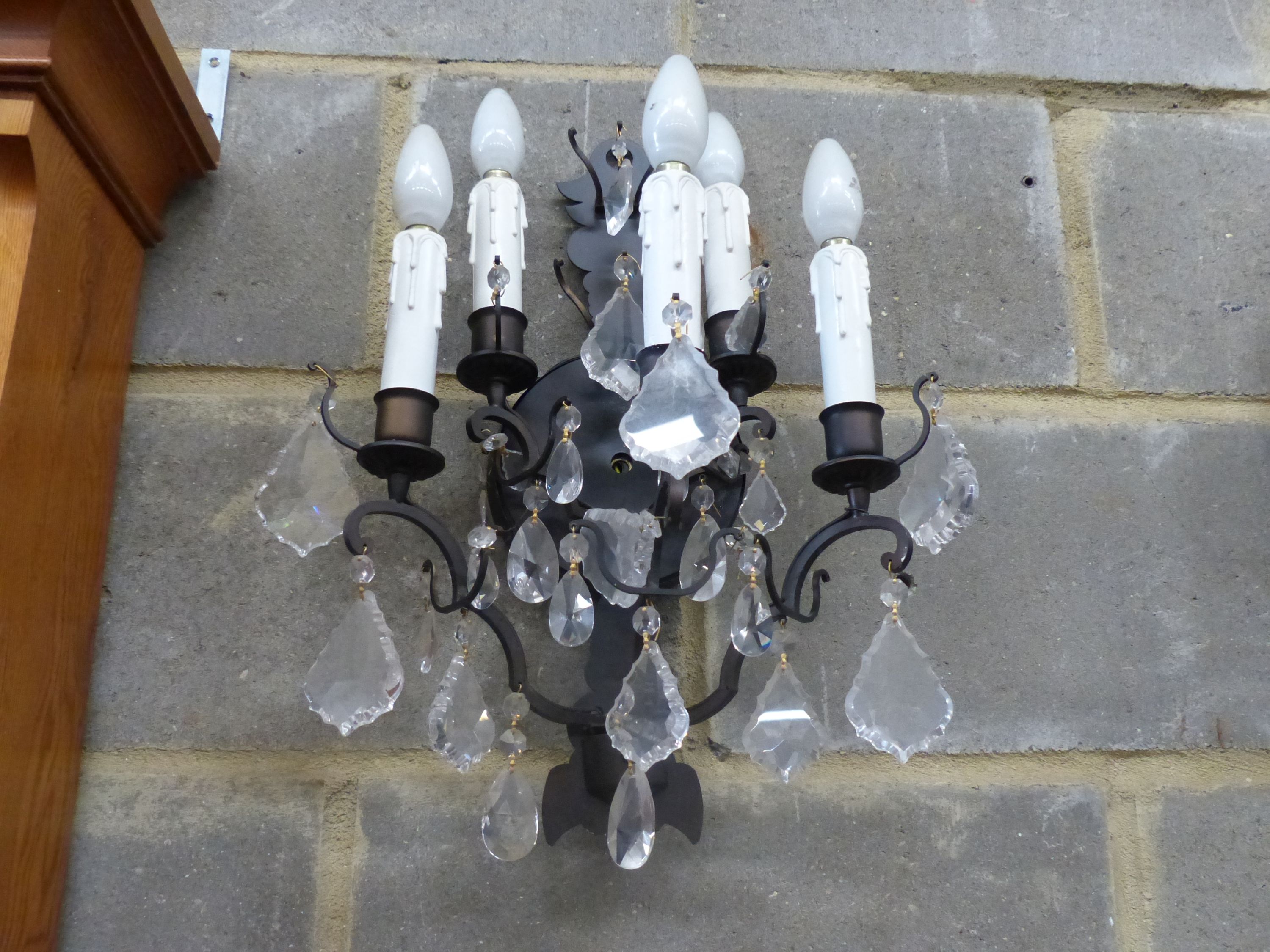 A set of six painted metal five branch wall lights, faceted glass drops, height 46cm